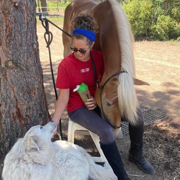 Alex with her horse Bella and dog Rose